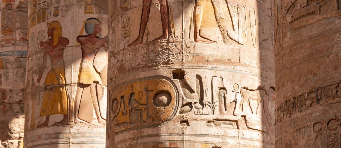 Hieroglyphs on the pillars of Karnak temple in Egypt