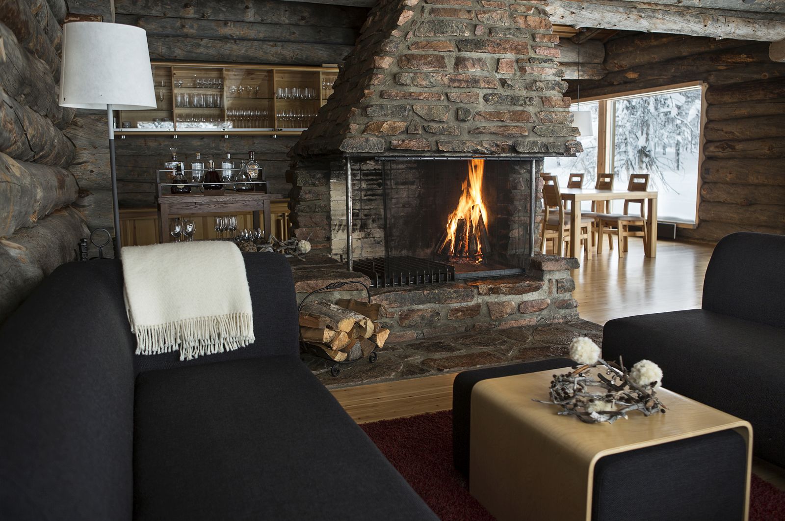 The lounge and roaring fire at Javri Lodge