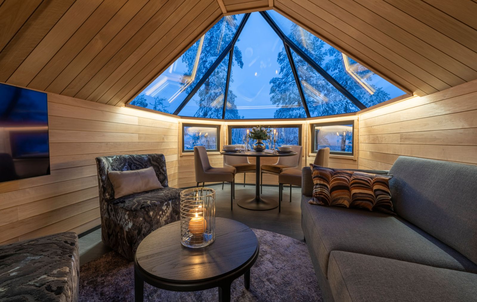 Cosy Living Area in Wood Cabin with Glass Ceiling at Luxury Resort Octola in Finnish Lapland