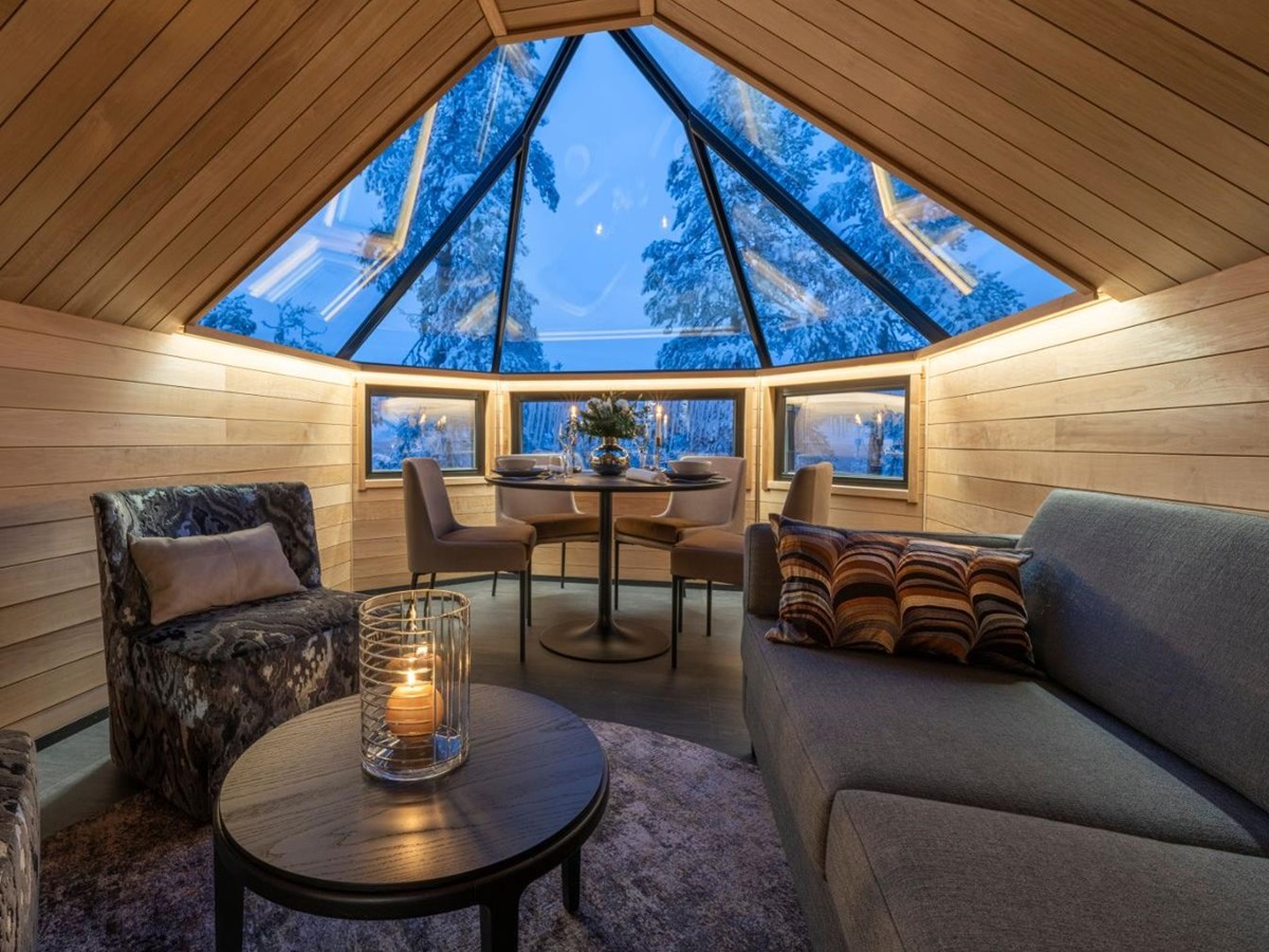 Cosy Living Area in Wood Cabin with Glass Ceiling at Luxury Resort Octola in Finnish Lapland