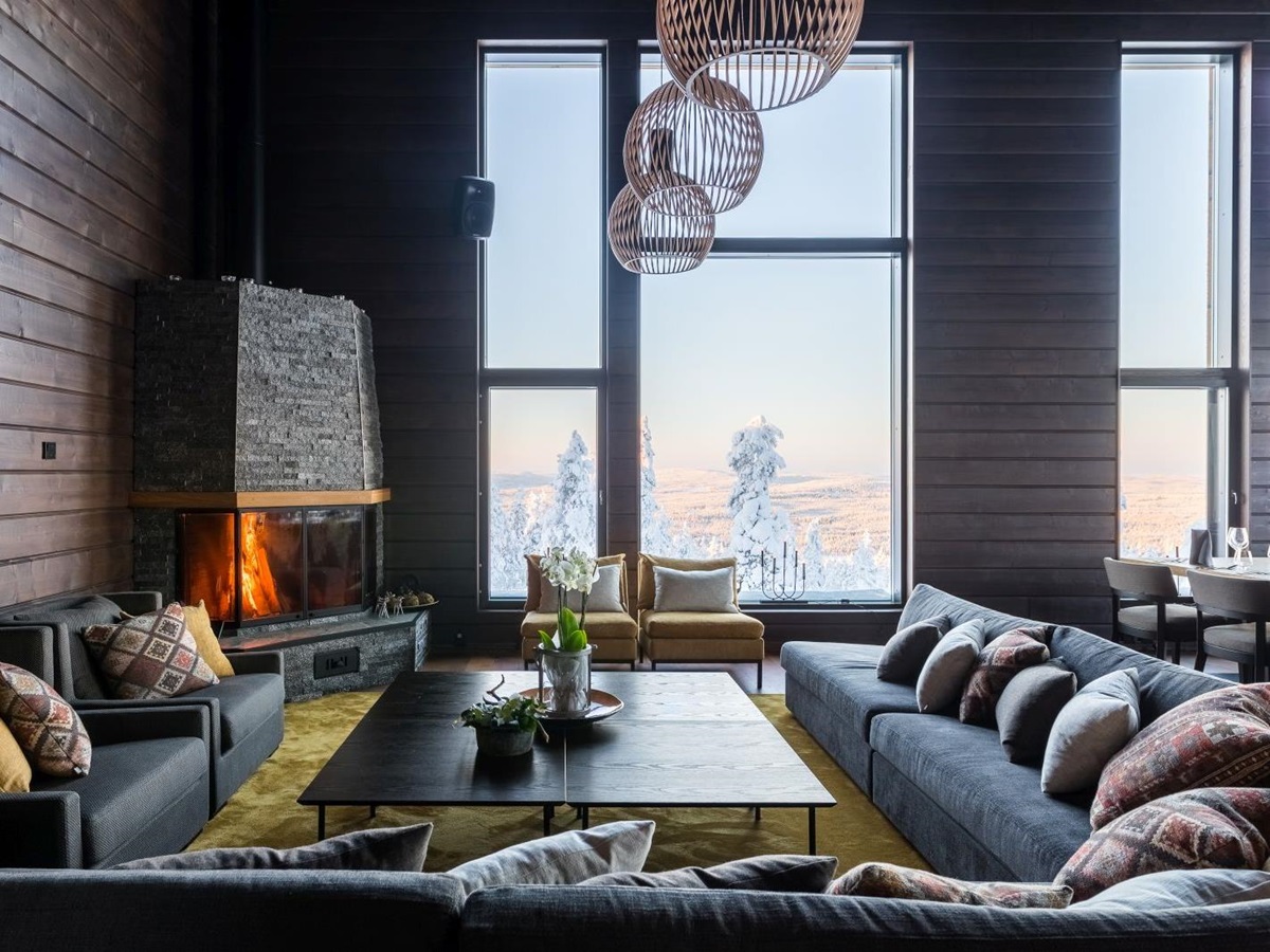 Lounge and fireplace at Octola wilderness lodge in Lapland Finland