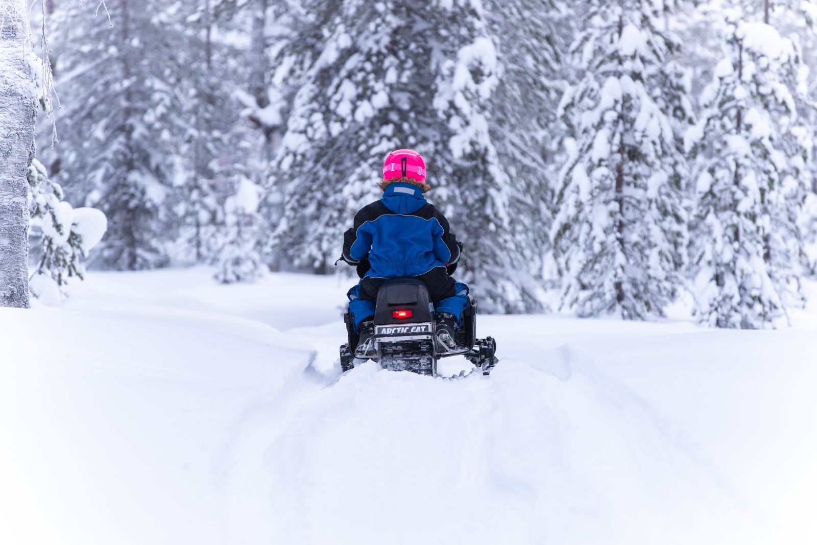 Mini snowmobile tour from Octola  wilderness lodge in Finnish Lapland