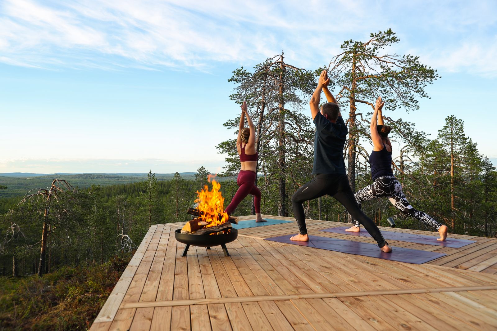 Outdoor yoga at Octola private wilderness lodge in Finland