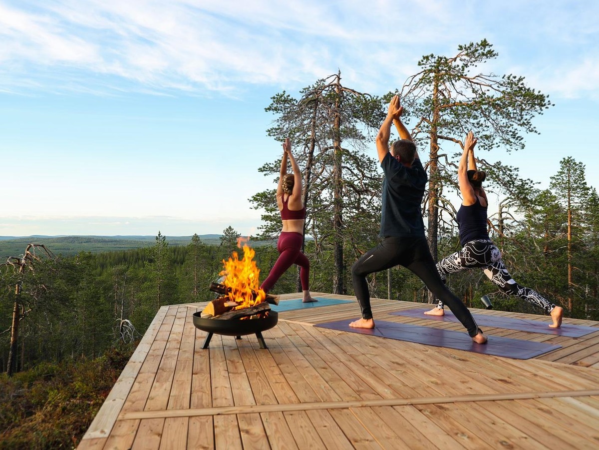 Outdoor yoga at Octola private wilderness lodge in Finland