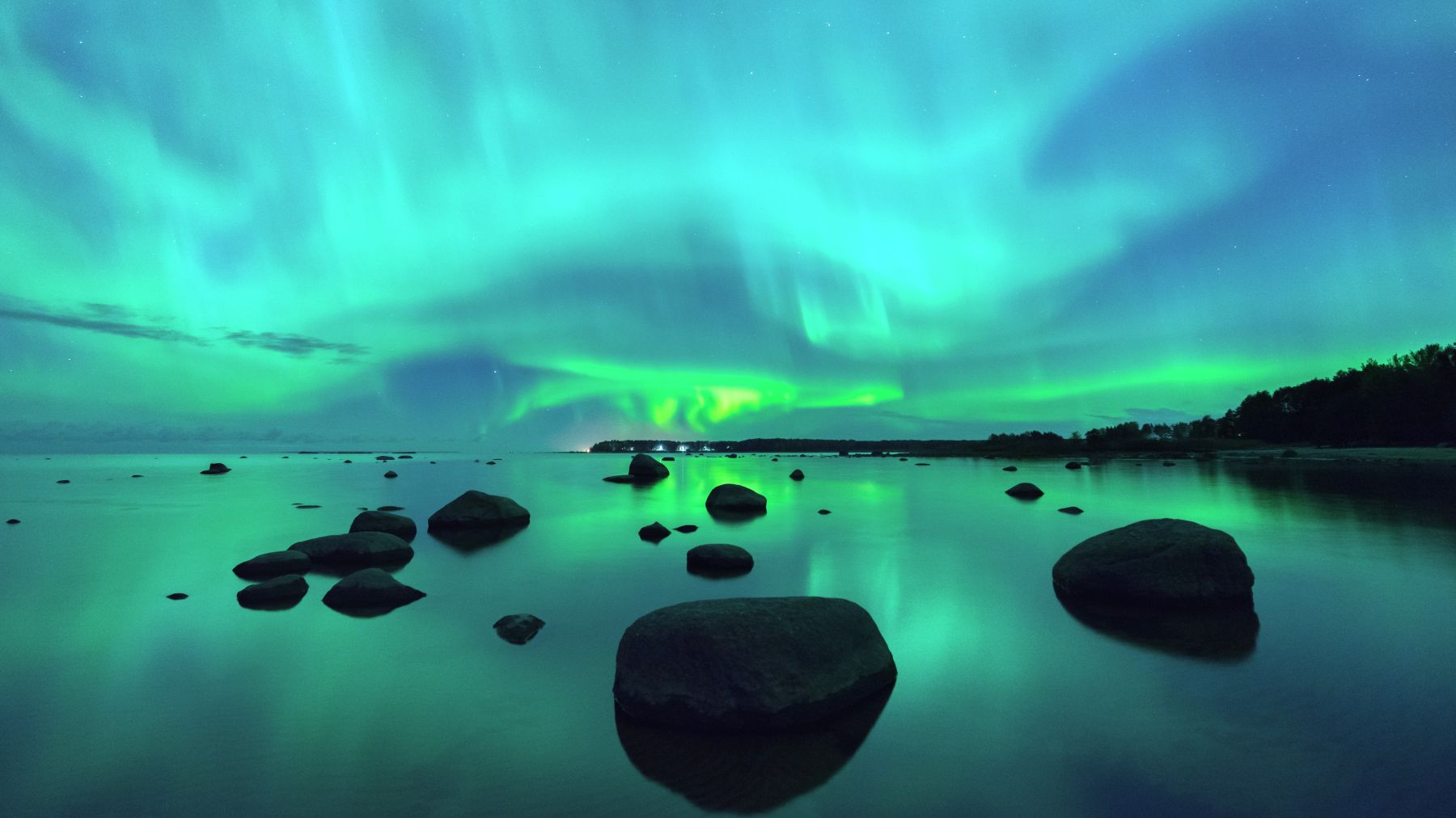 Northern Lights over a lake in Finland