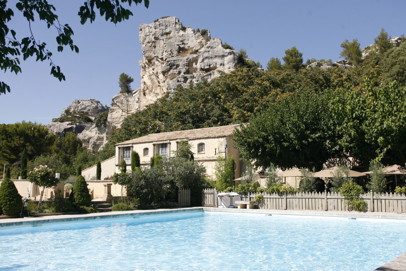 Outdoor swimming pool and facade of Baumaniere, France