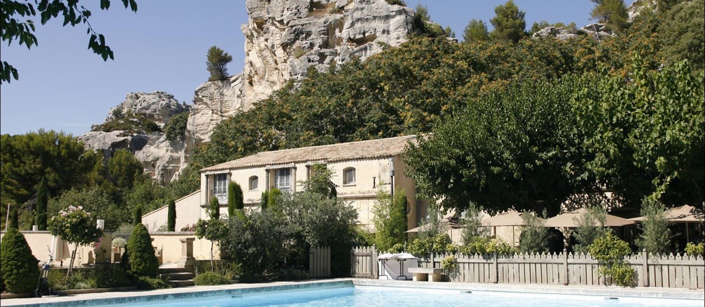 Outdoor swimming pool and facade of Baumaniere, France