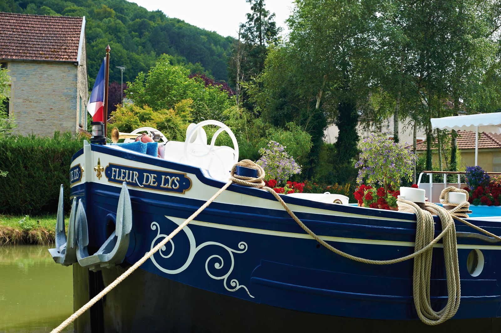 The bow of the Belmond Fleur de Lys river barge in France