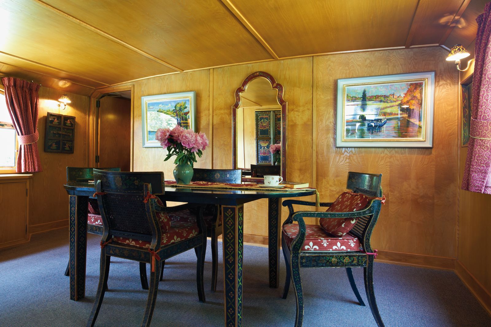 Dining room on board the Belmond Fleur de Lys river barge in France