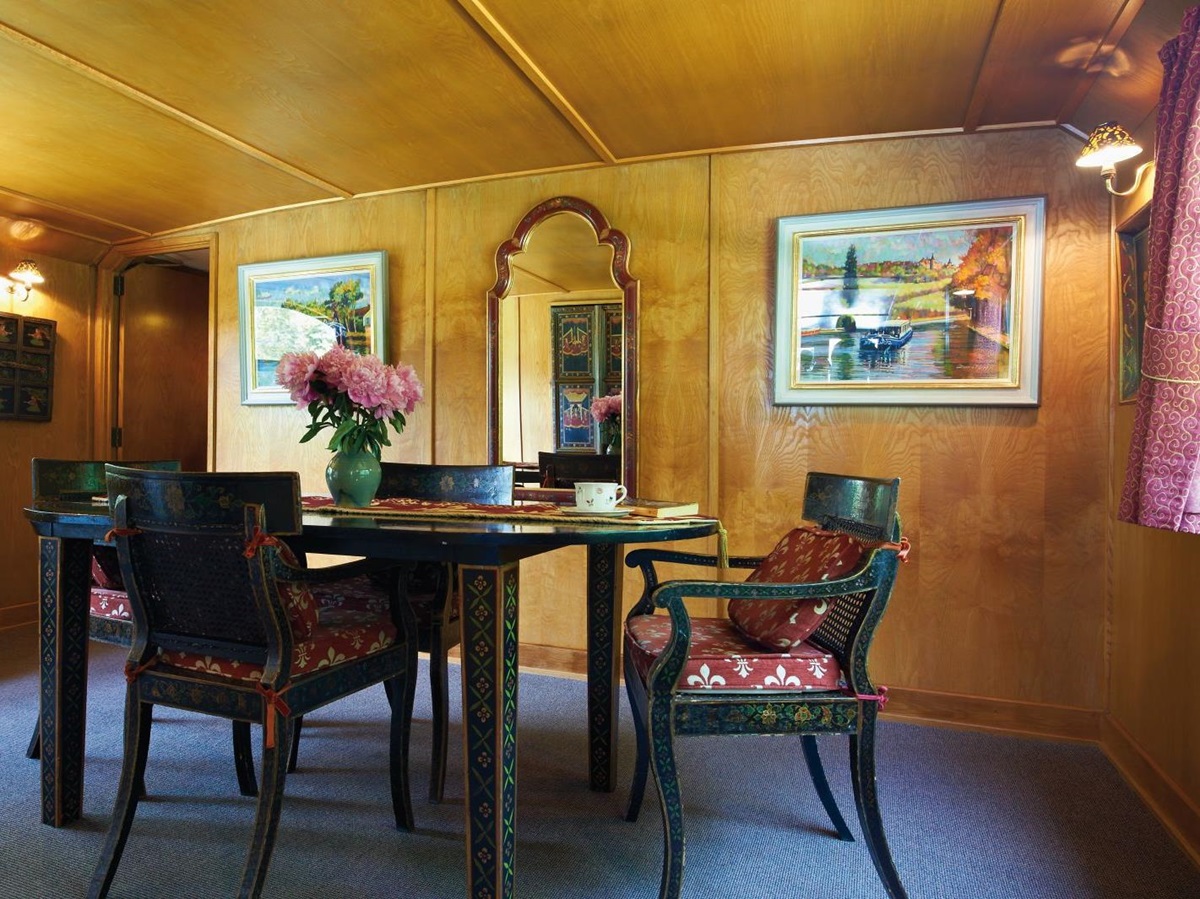Dining room on board the Belmond Fleur de Lys river barge in France