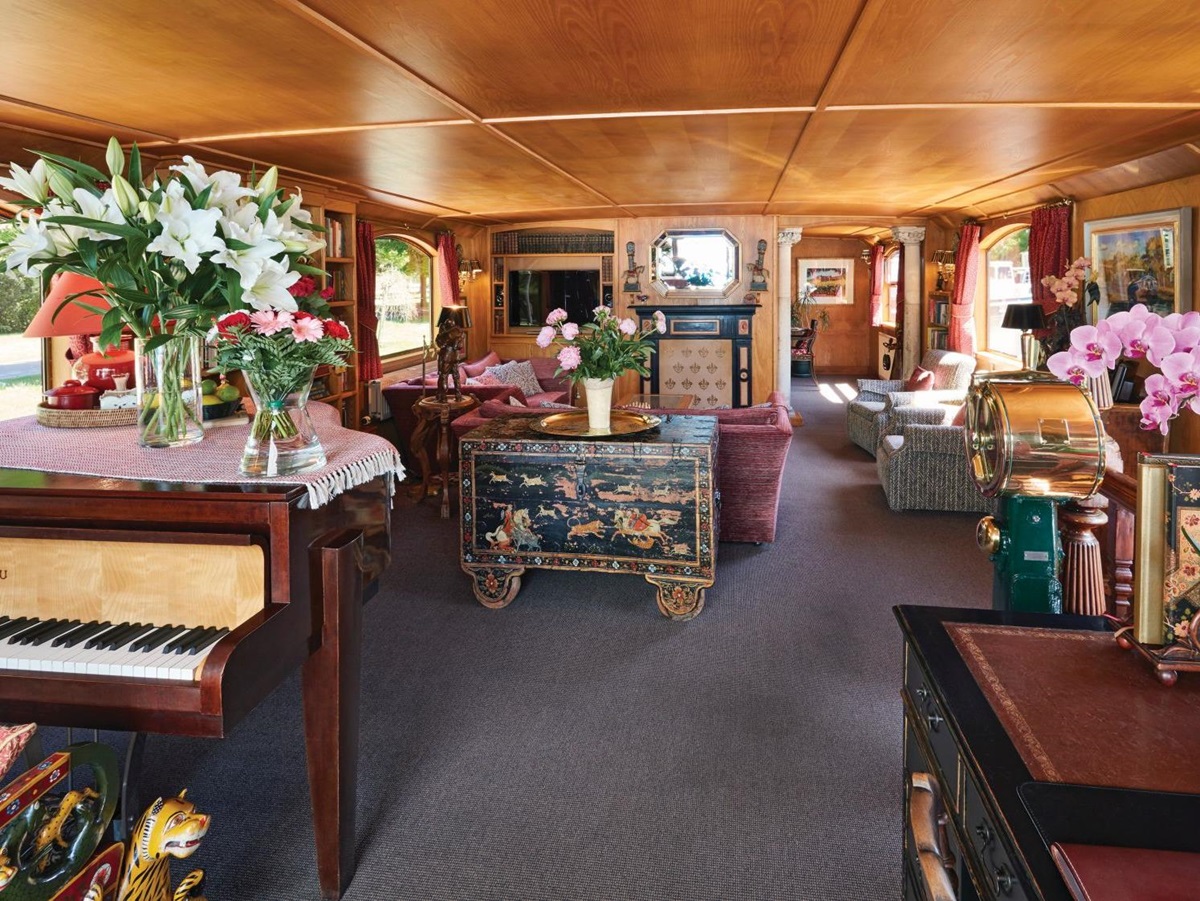 Lounge and grand piano on board the Belmond Fleur de Lys river barge in France