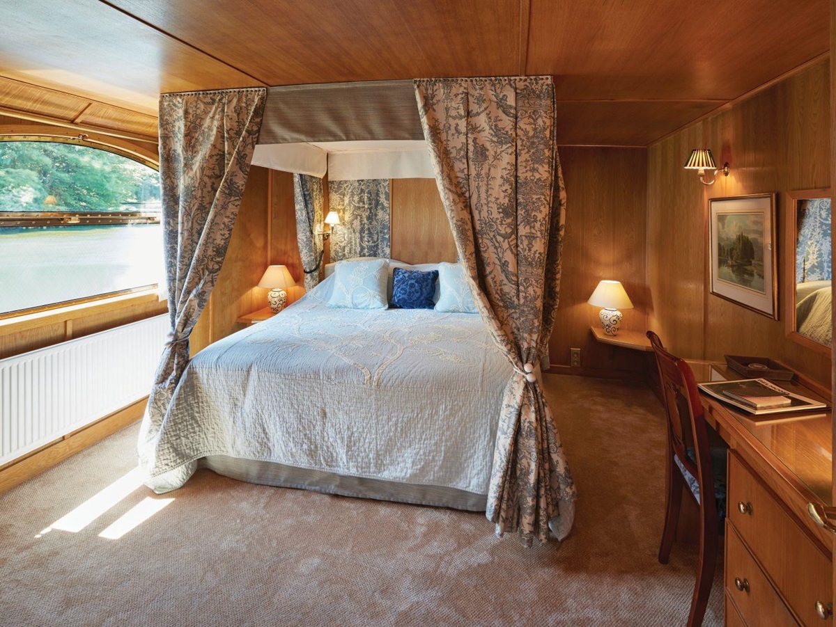 Cabin and river view on board the Belmond Fleur de Lys river barge in France