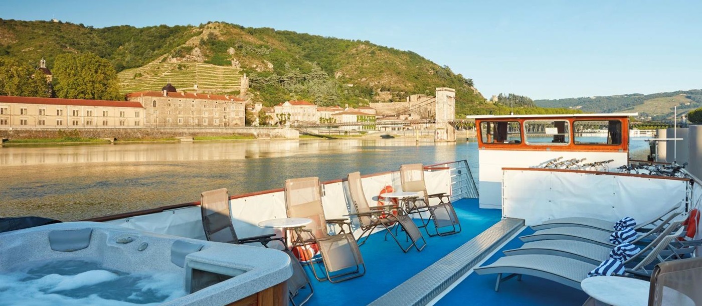 Jacuzzi and sun deck on board the Belmond Napoleon river barge in France