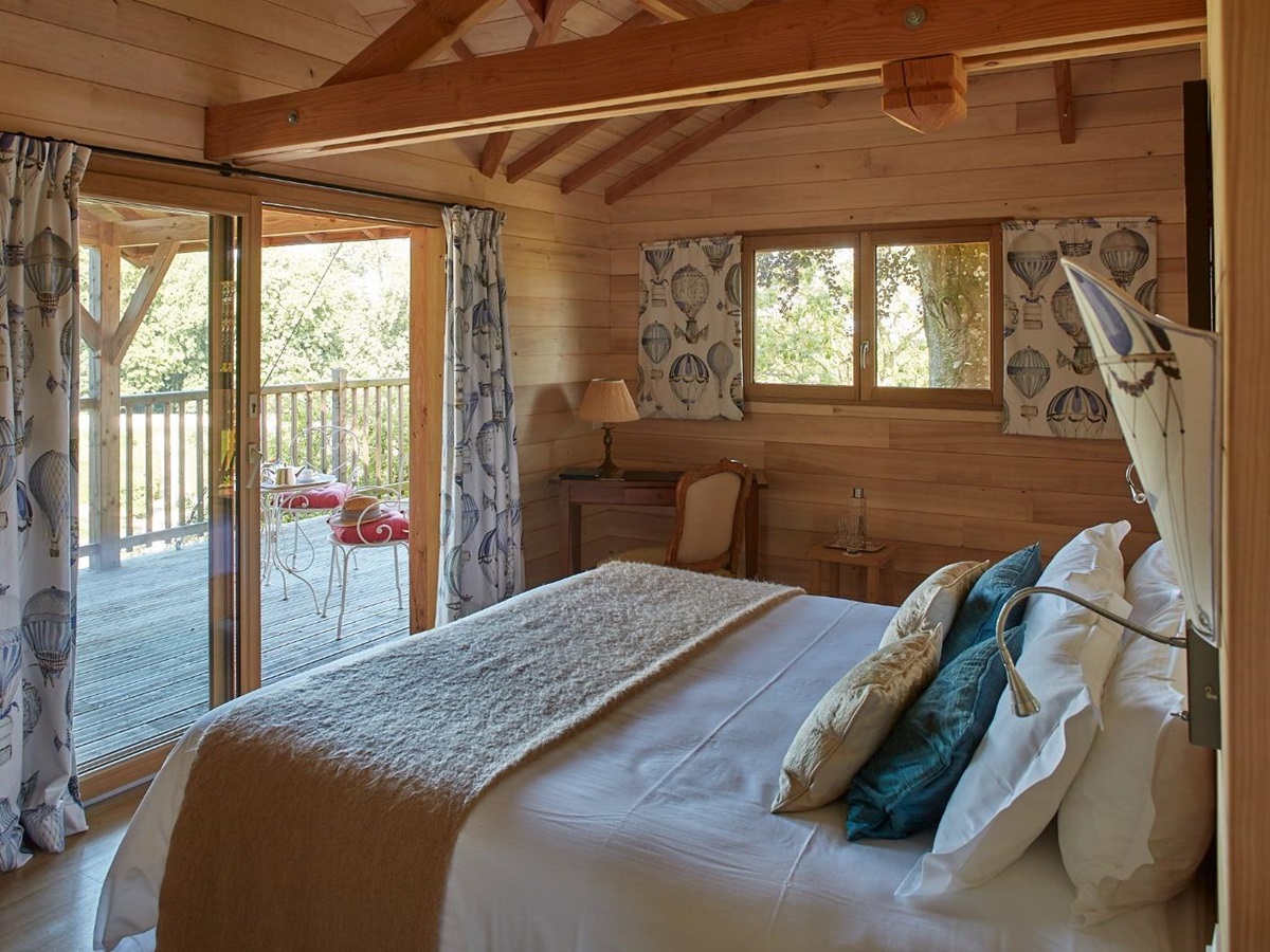 Bedroom and grounds view at Chateau d'Audrieu in the Normandy region of France