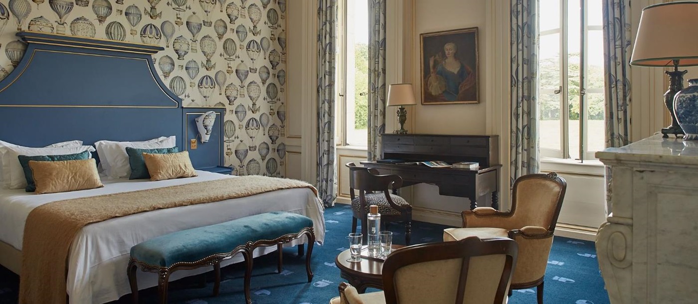 Blue guest suite at Chateau d'Audrieu in the Normandy region of France