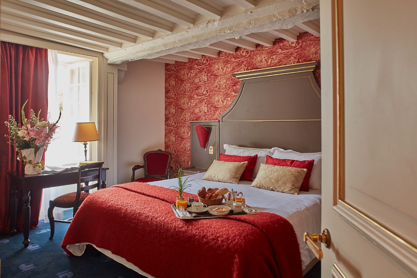 double bed in guest suite at Chateau d'Audrieu in the Normandy region of France