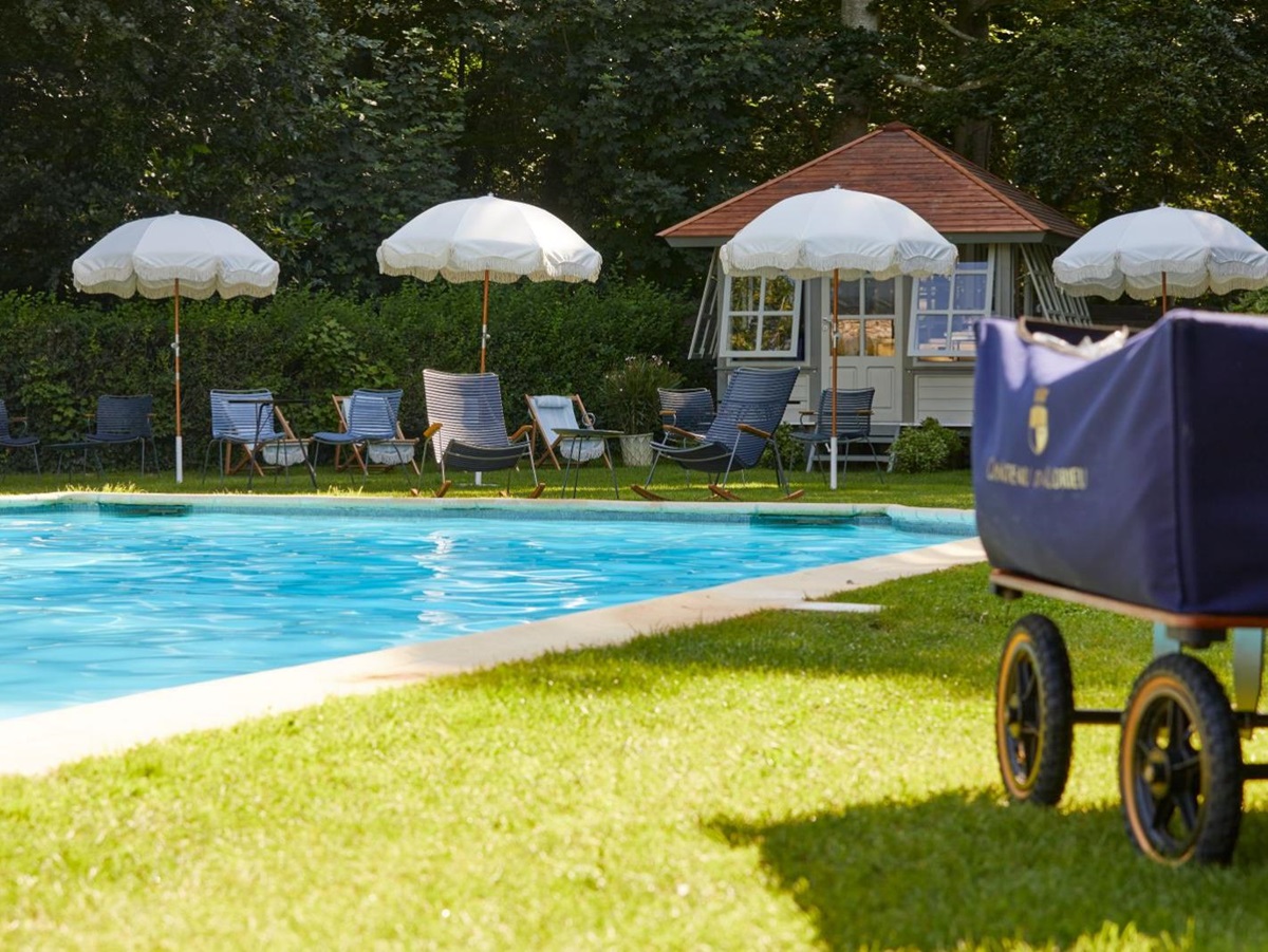 Poolside and sunbeds at Chateau d'Audrieu in the Normandy region of France
