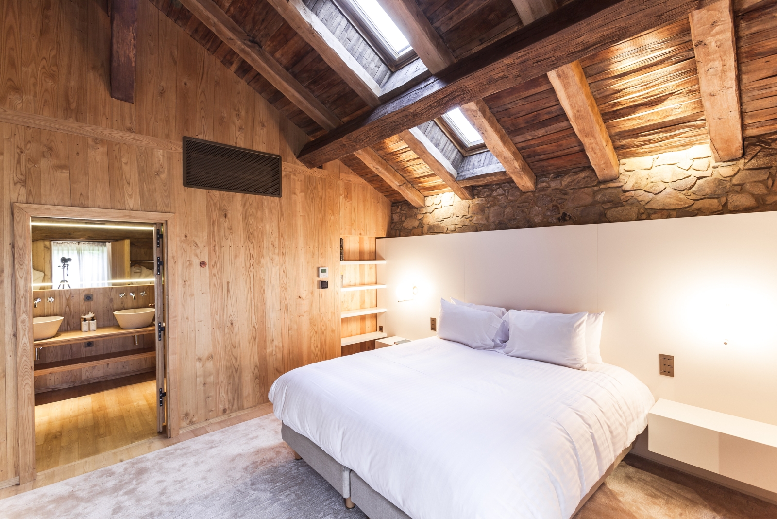 double bedroom with vaulted ceiling at domaine des etangs in france
