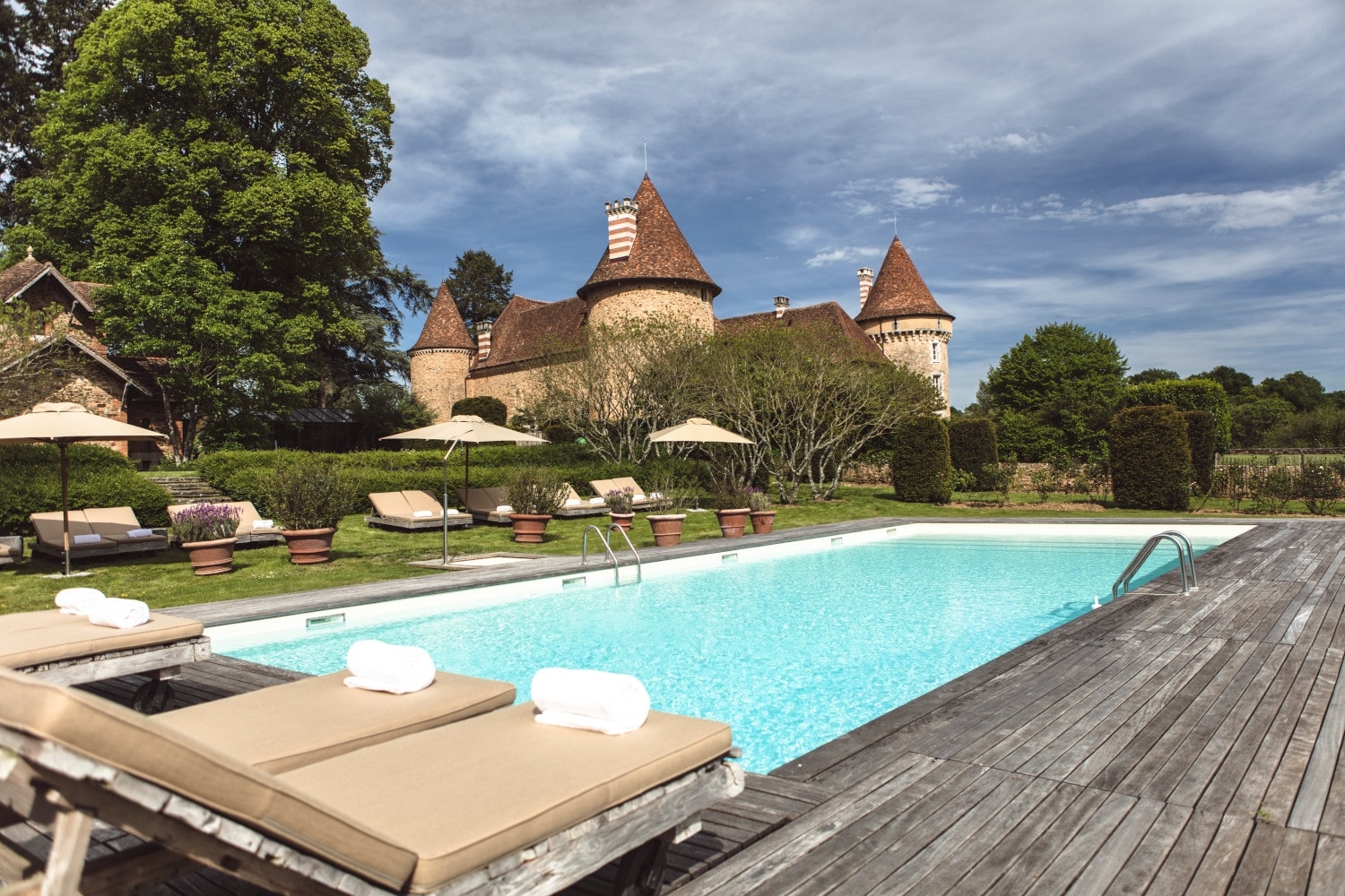 outdoor pool area at domaine des etangs in france