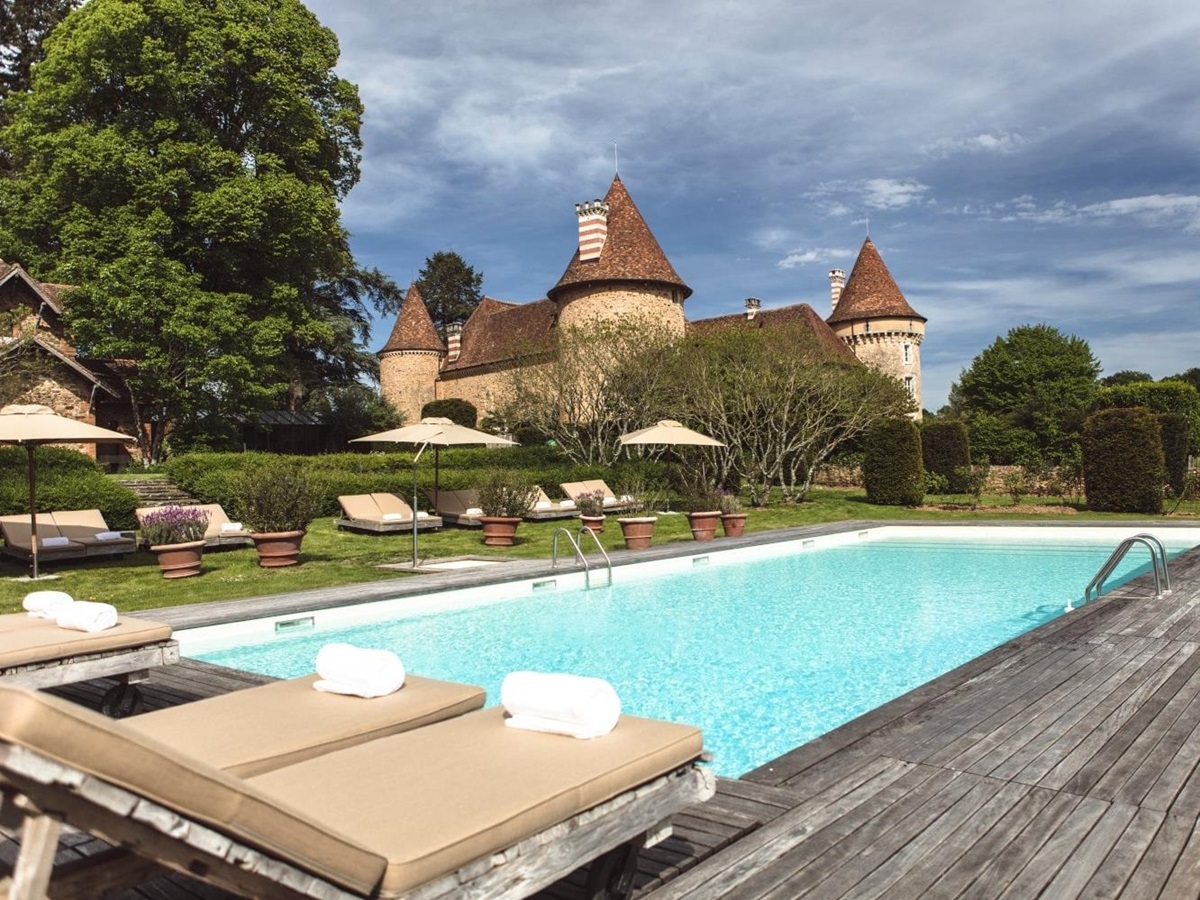 outdoor pool area at domaine des etangs in france