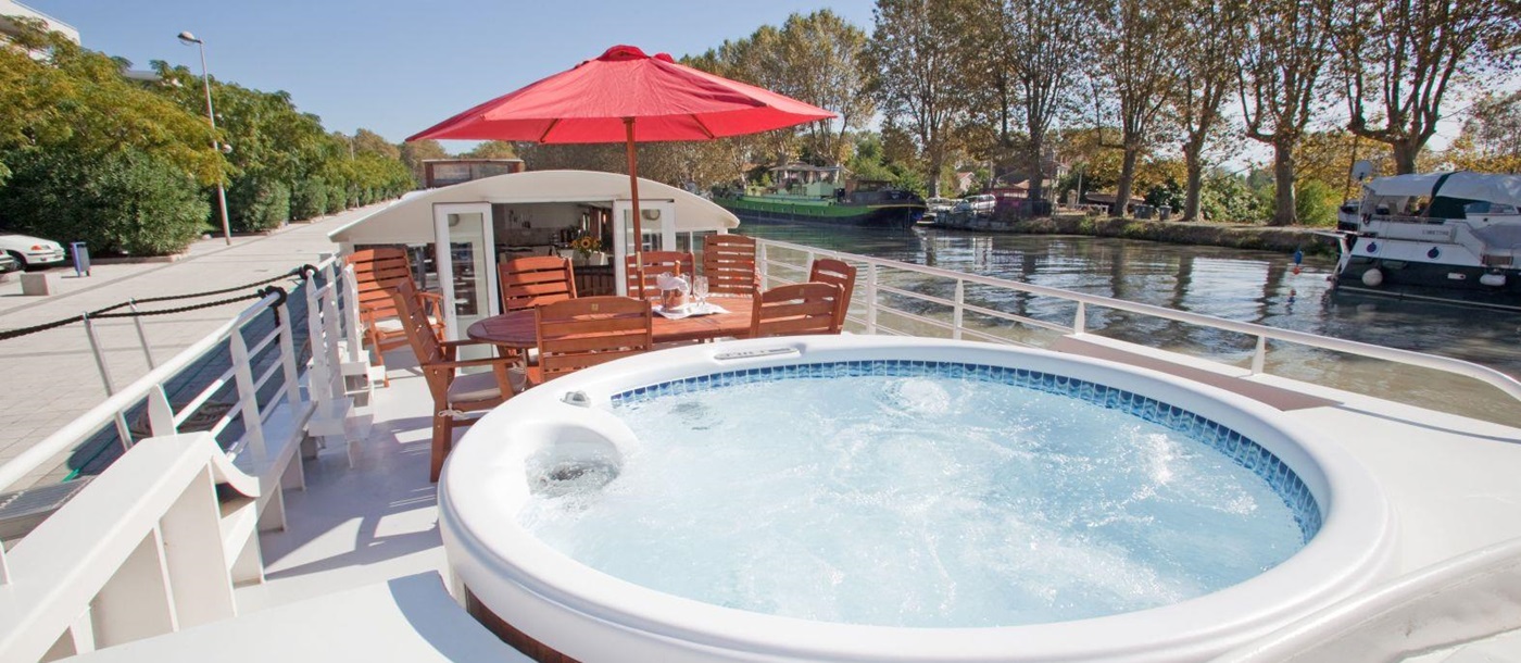 Jacuzzi and sun deck on board the Enchante river cruise in France