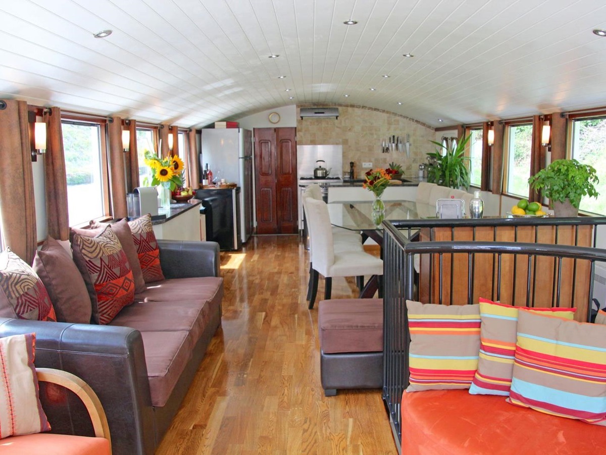 Spacious lounge on board the Enchante river cruise in France