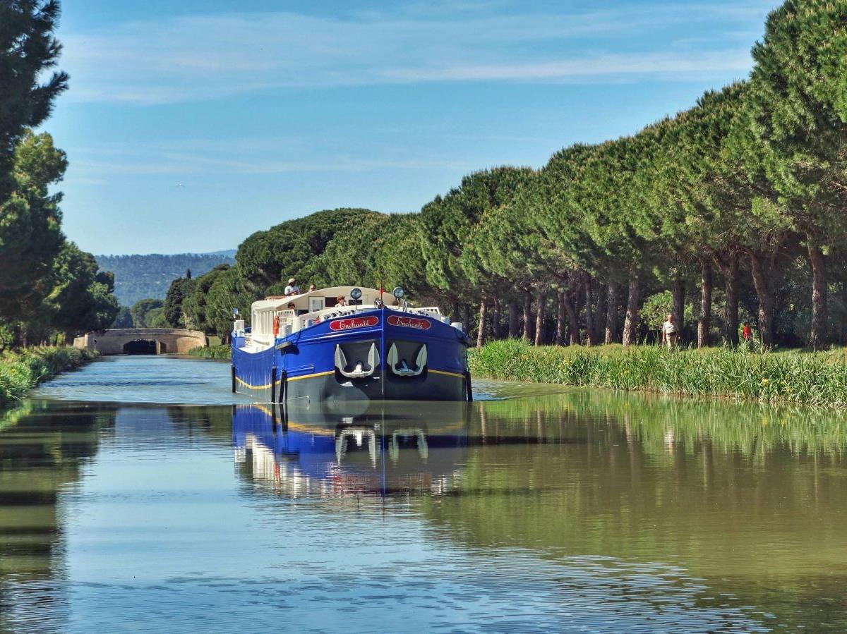 The Enchante barge sailing through the French countryside