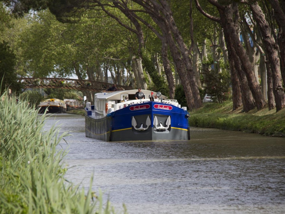 The Enchante barge sailing through the French countryside