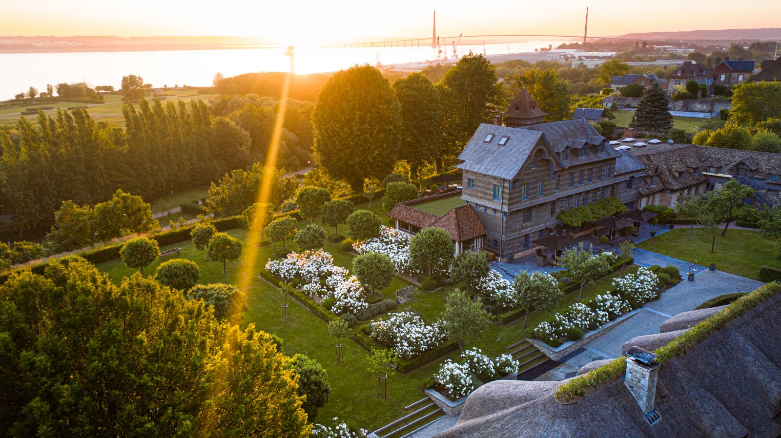 Aerial sunset view of Ferme Saint Simeon in Normandy, France
