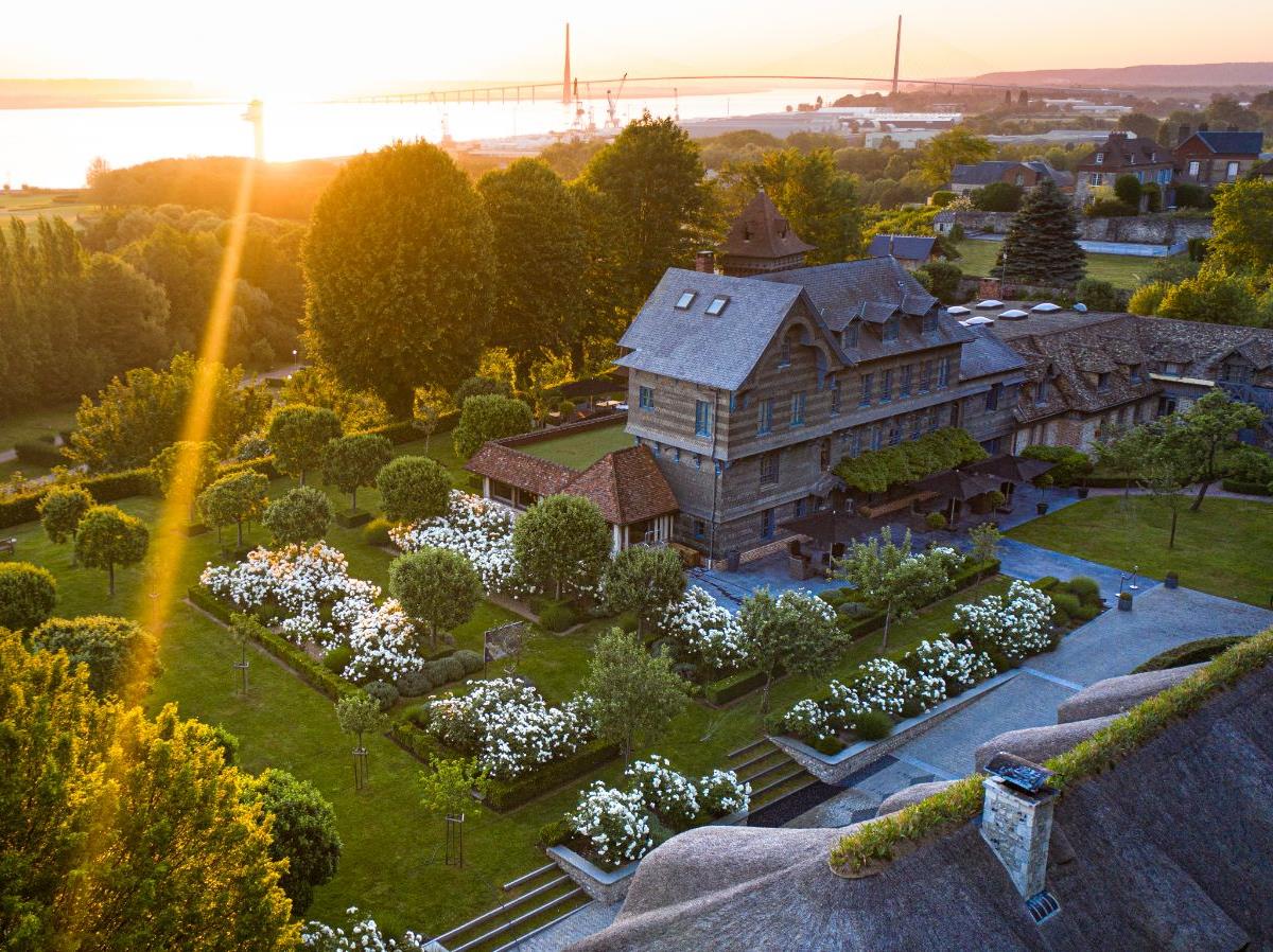 Aerial sunset view of Ferme Saint Simeon in Normandy, France