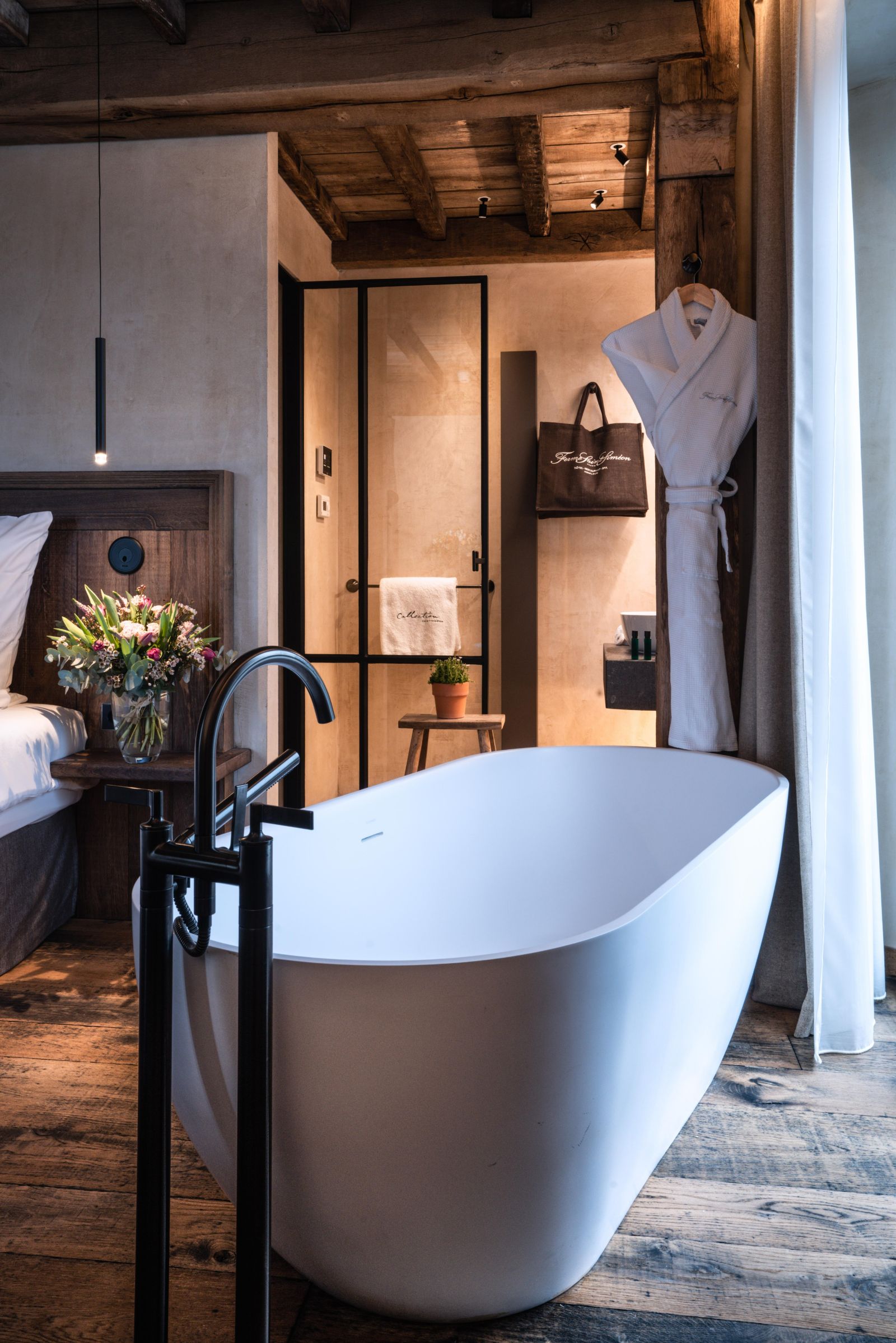 Bathroom of a deluxe guest suite at Ferme Saint Simeon in Normandy, France