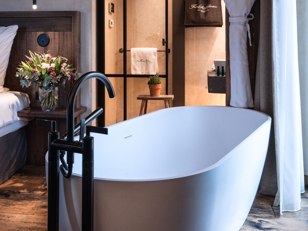 Bathroom of a deluxe guest suite at Ferme Saint Simeon in Normandy, France