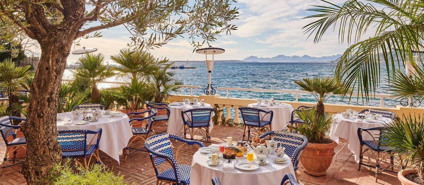 Alfresco dining at Hotel Belles RIves on the Cote d'Azur in France