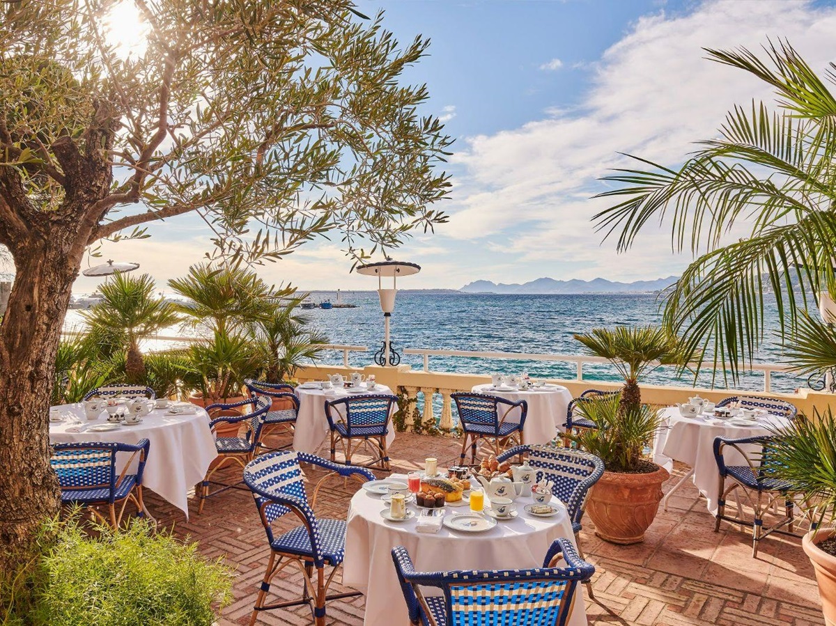 Alfresco dining at Hotel Belles RIves on the Cote d'Azur in France