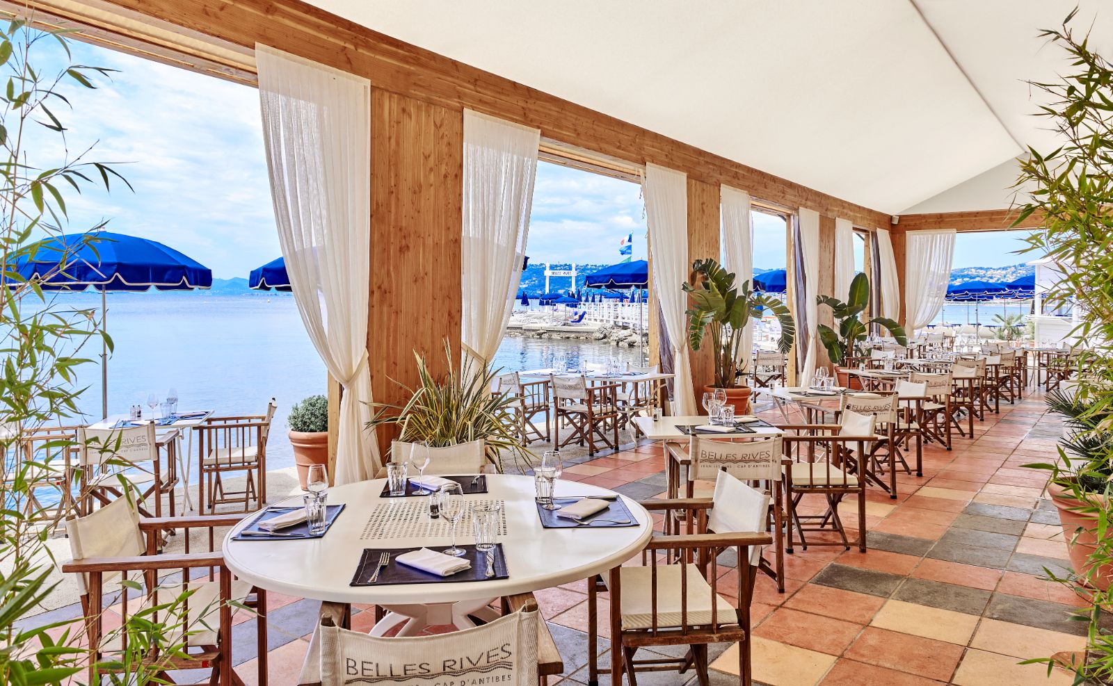 Outside restaurant seating at Hotel Belles RIves on the Cote d'Azur in France