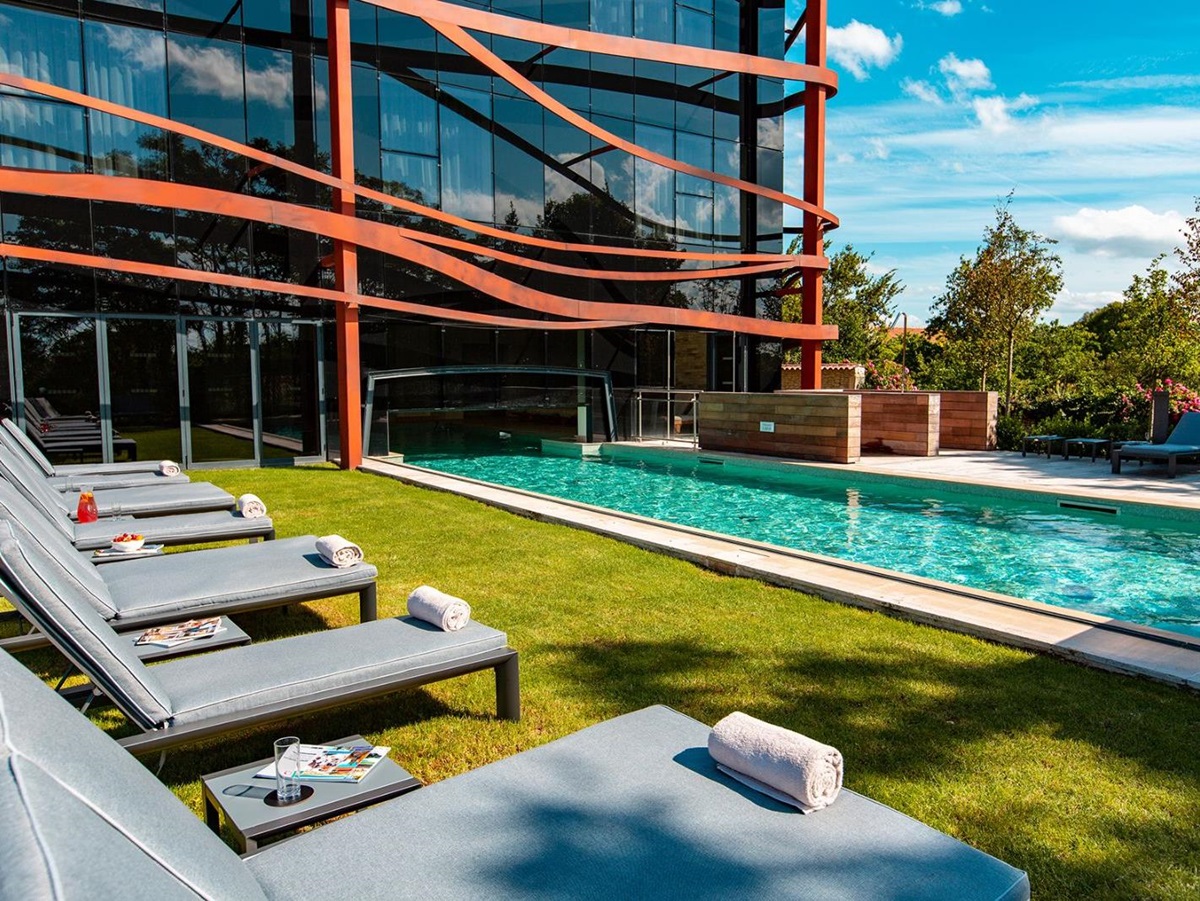 Outdoor pool area at Hotel Chais Monnet & Spa in South West France