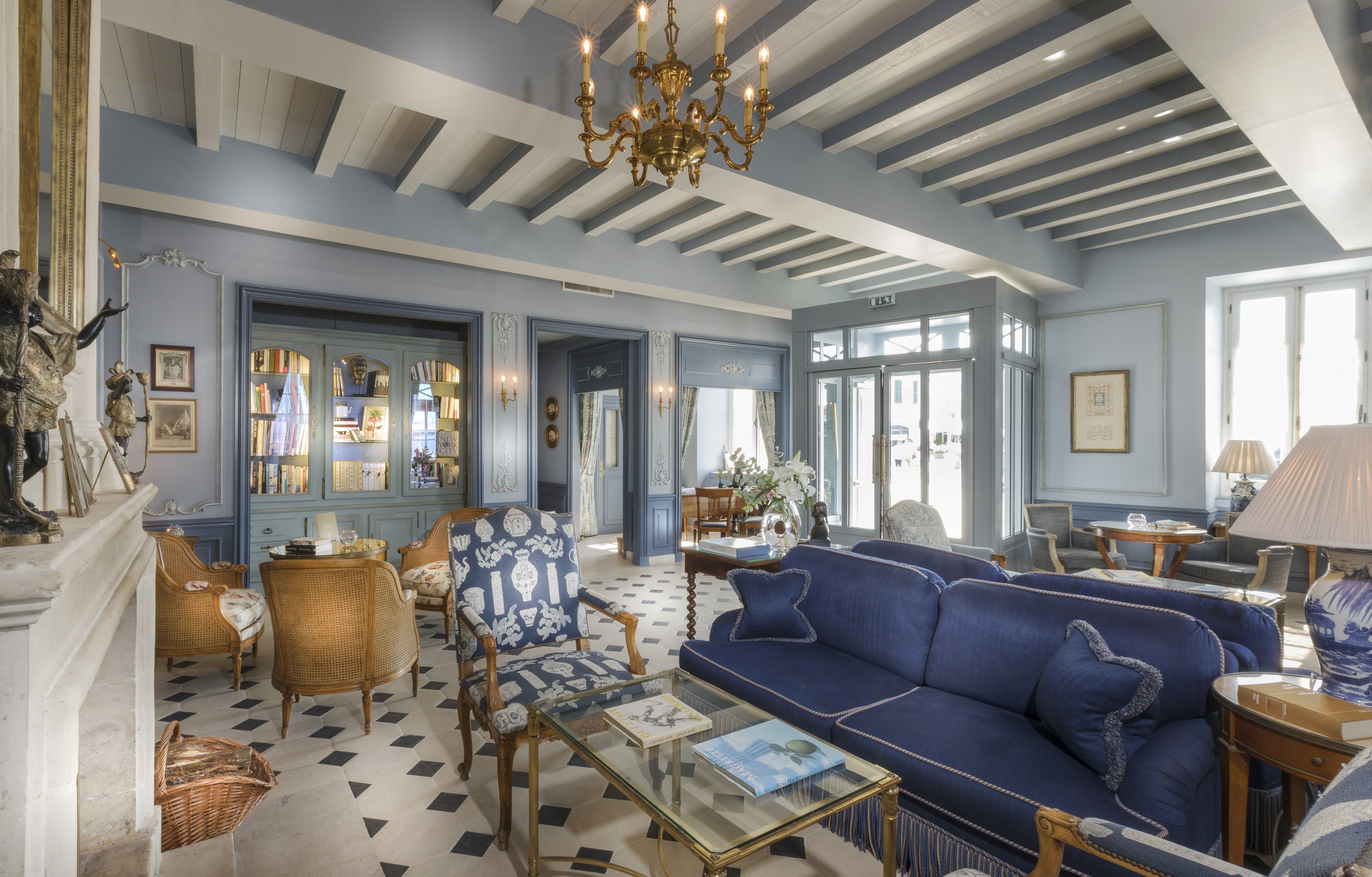Comfortable chairs and sofas in a light blue lounge