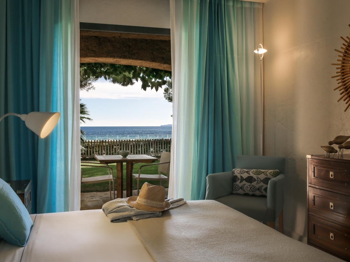 Bedroom with view at Hotel La Pinede Plage in France
