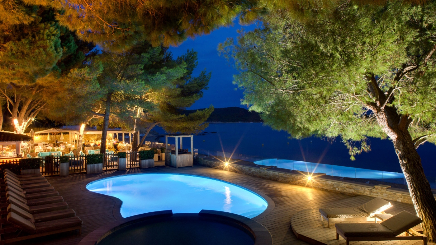Pool at night at Hotel La Pinede Plage in France