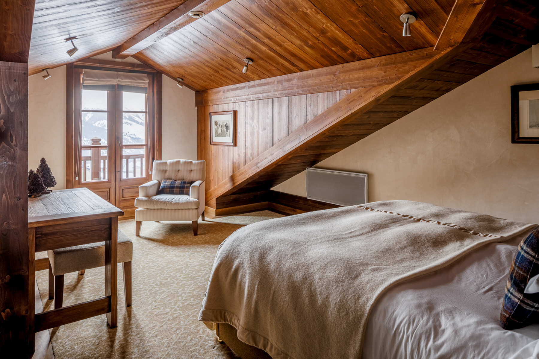 Guest suite bedroom at Hotel Le Portetta in Courchevel