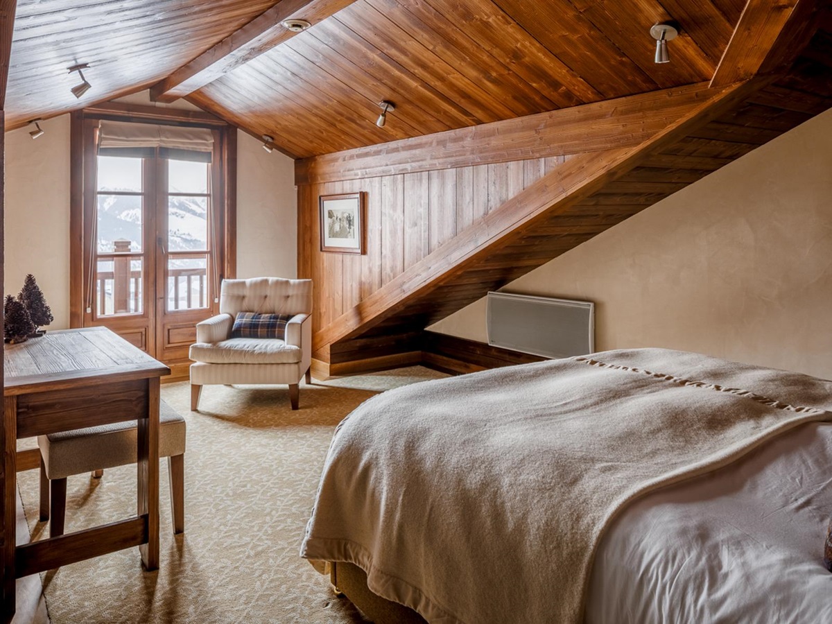 Guest suite bedroom at Hotel Le Portetta in Courchevel