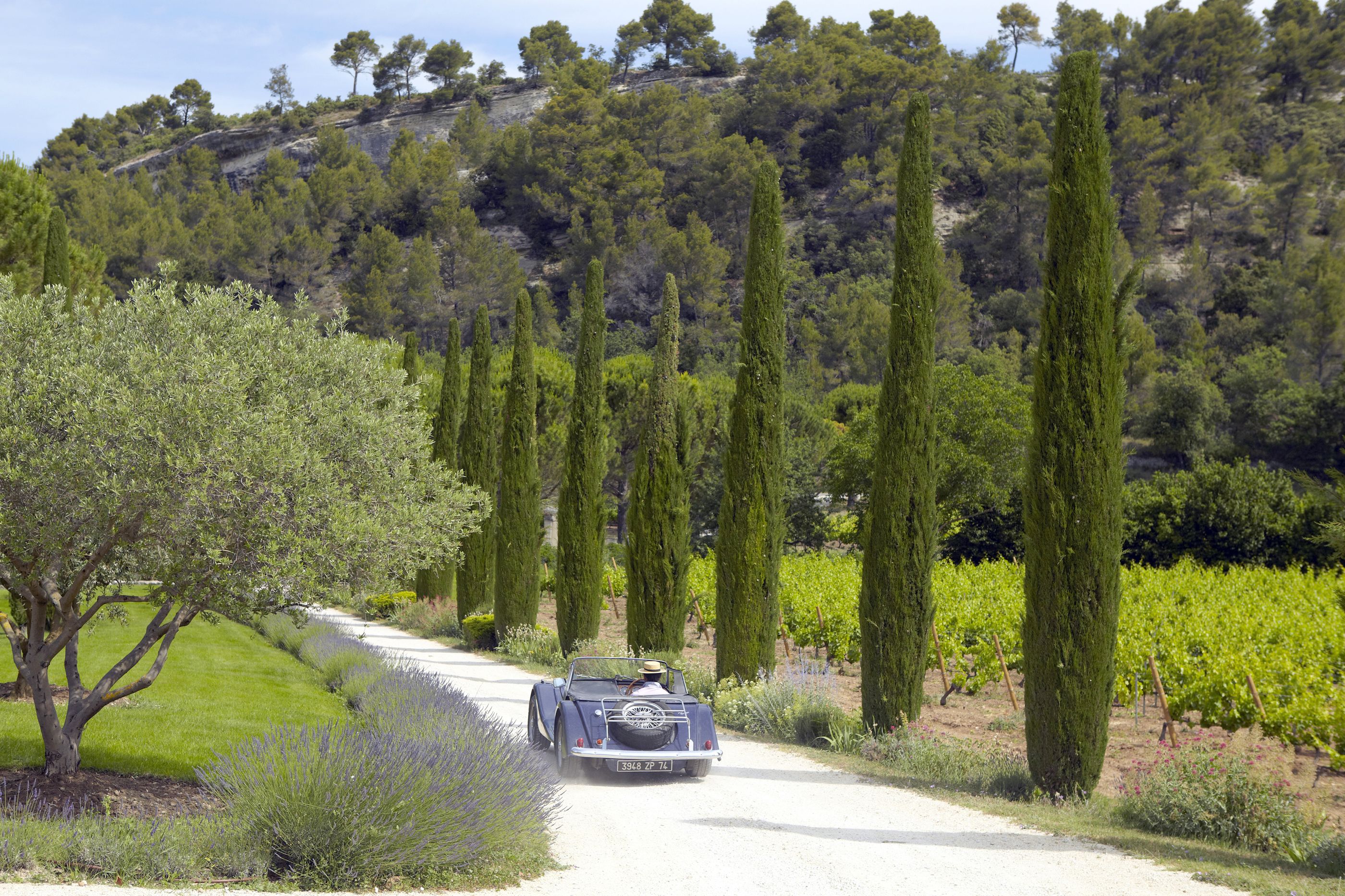 Drive way to La Bastide de Marie, France with driving car