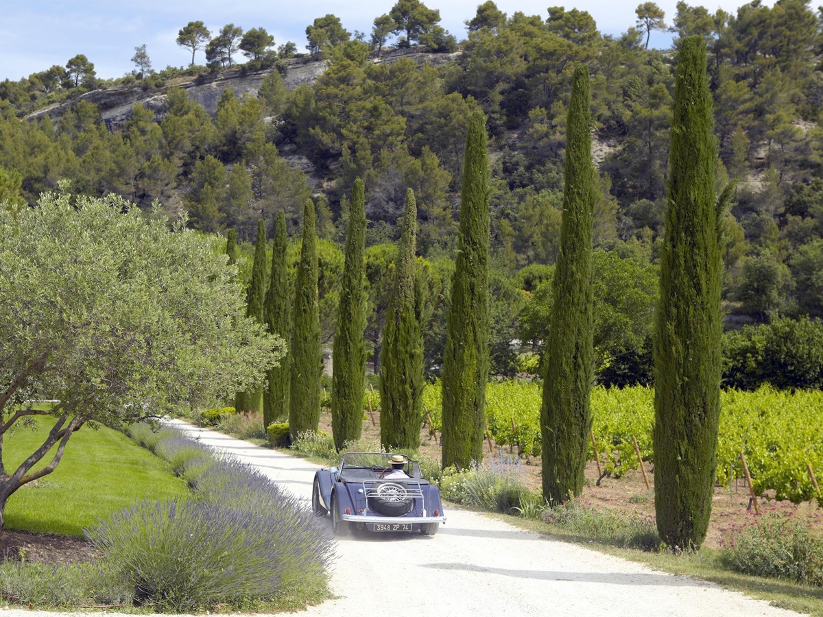 Drive way to La Bastide de Marie, France with driving car