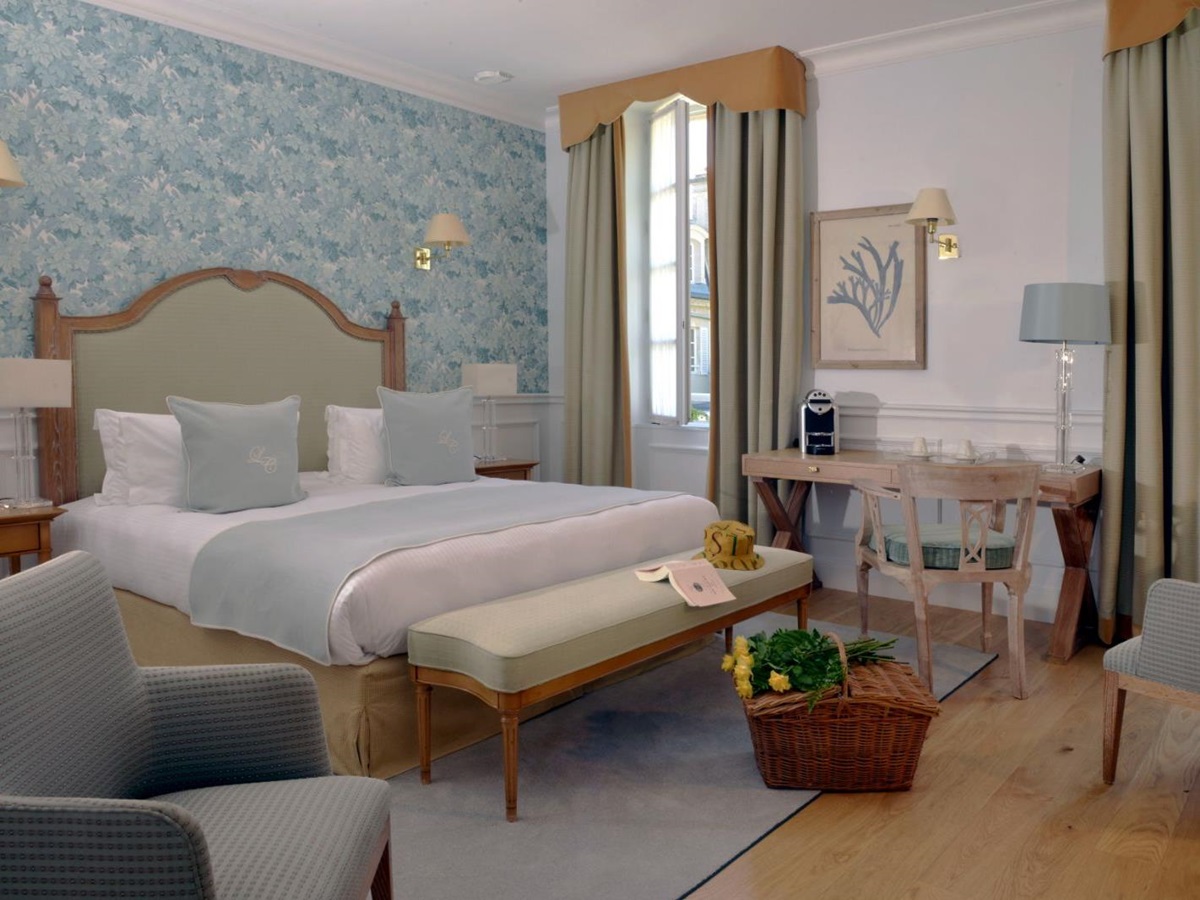 A guest bedroom at La Cheneviere in the Normandy region of France