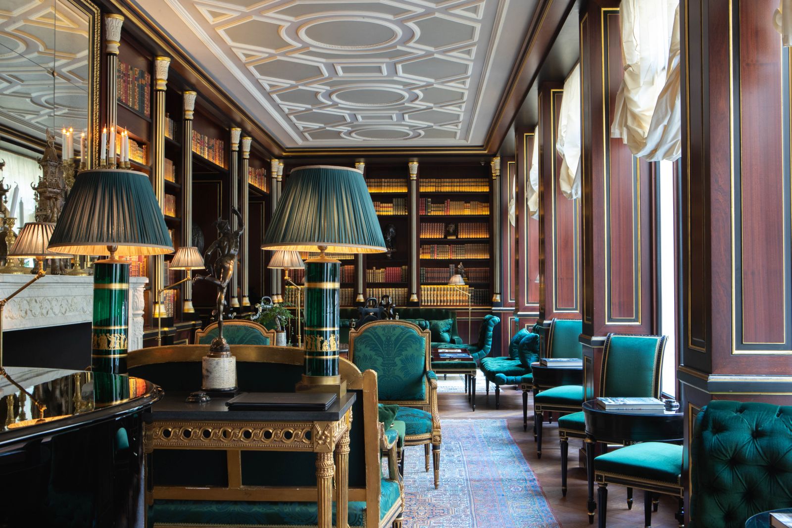 Library with blue furniture at La Reserve Hotel in Paris
