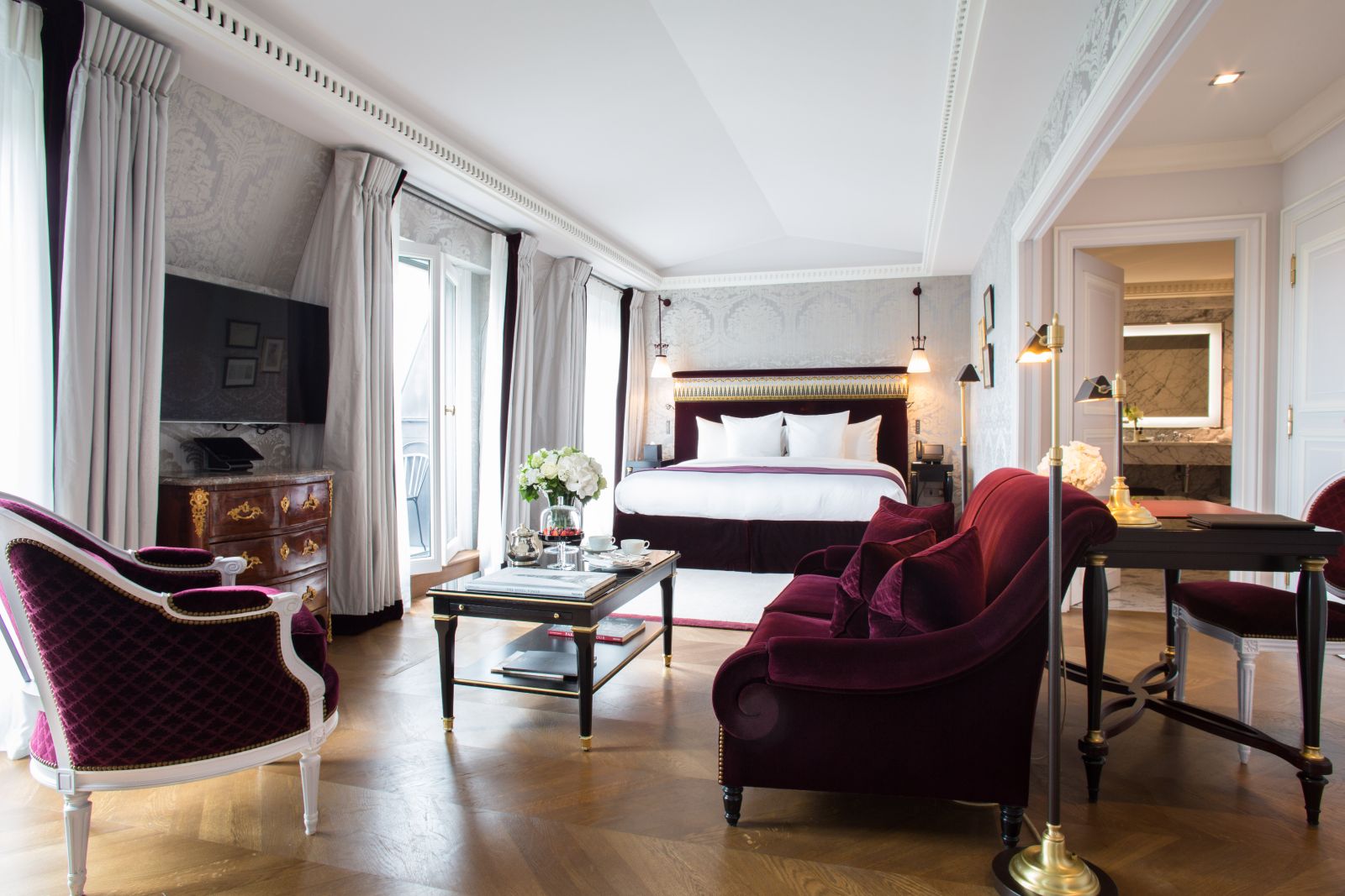 Bedroom suite and living area at La Reserve Hotel in Paris