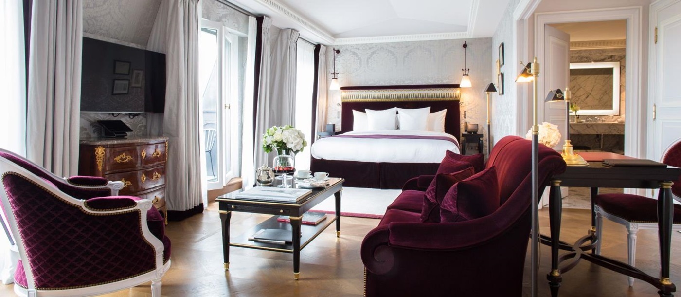 Bedroom suite and living area at La Reserve Hotel in Paris