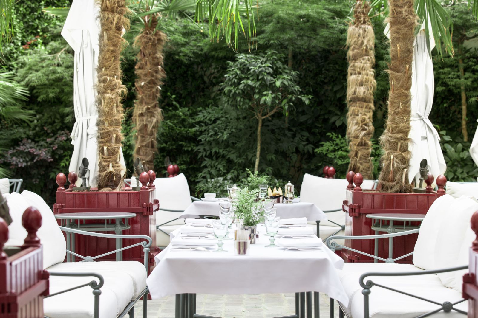 Table and chsirs on the patio at La Reserve Hotel in Paris