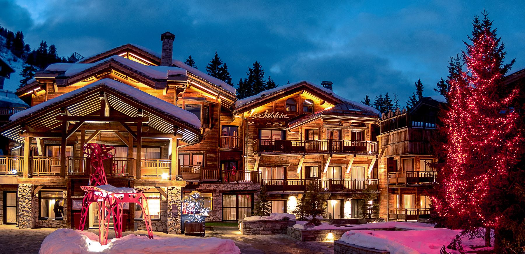 Exterior view of Hotel La Sivolière in Courchevel at night