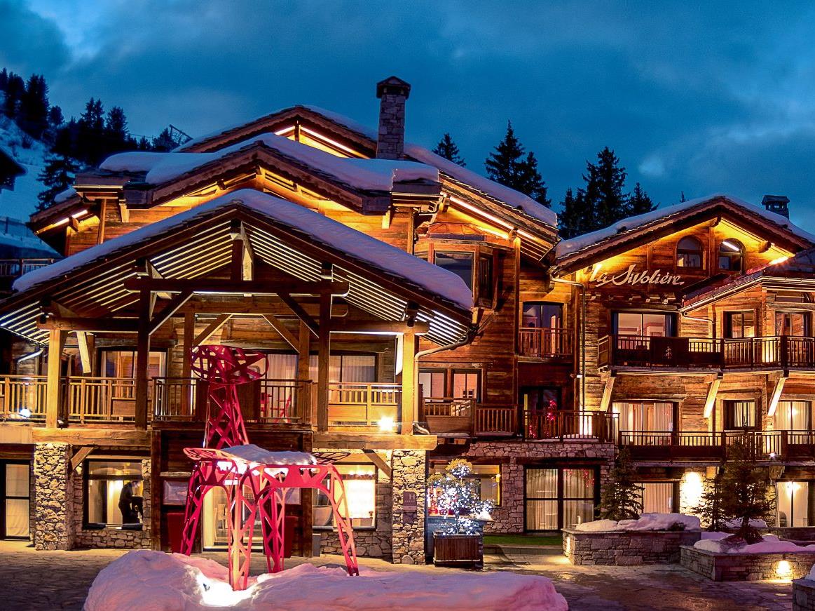 Exterior view of Hotel La Sivolière in Courchevel at night